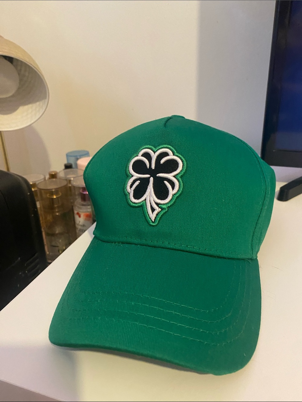 “I MAKE MY OWN LUCK.” dark green hats